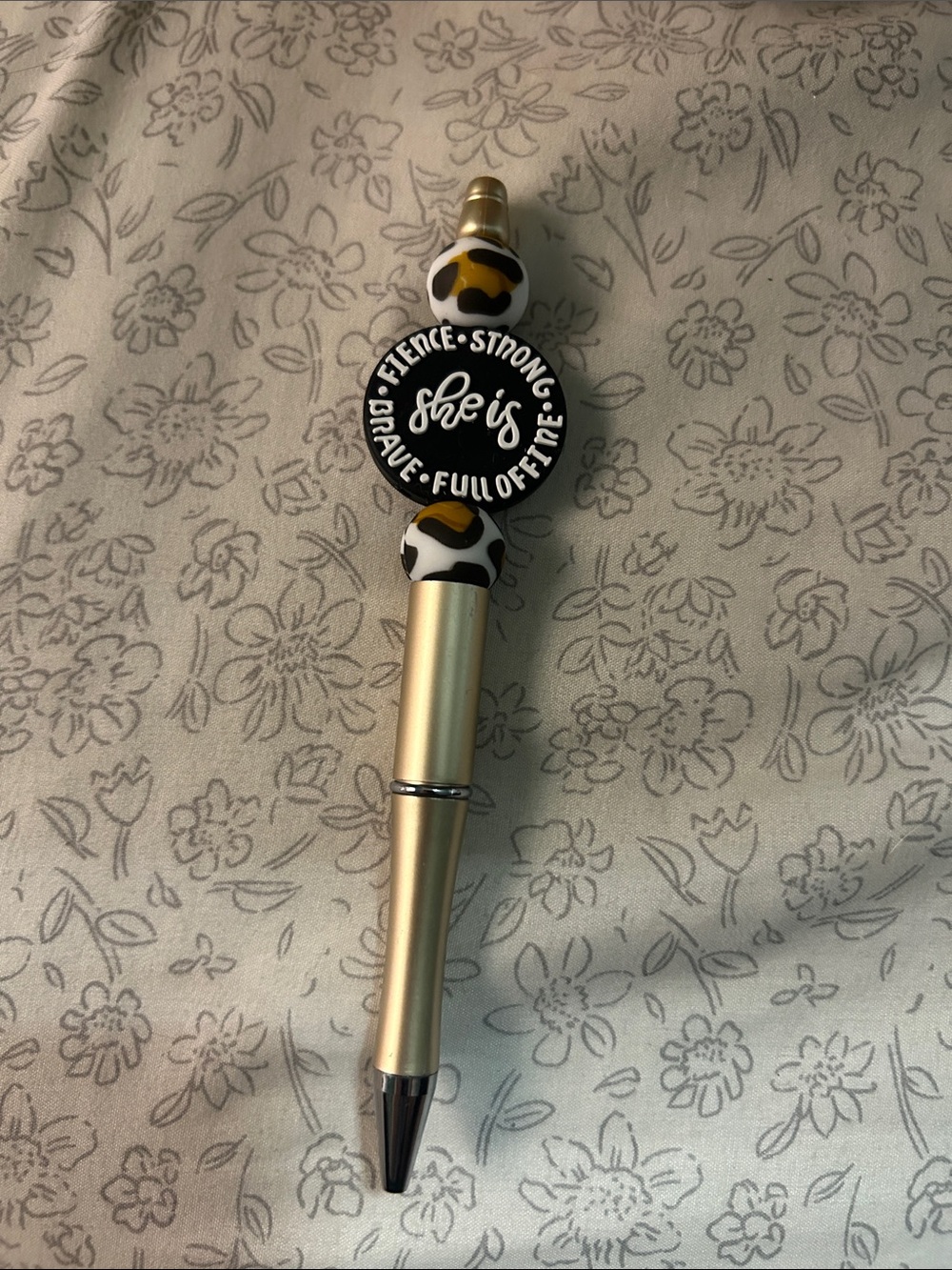 Gold Ballpoint Pen with Inspirational 'She Is' Badge